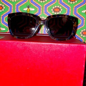 Prada tortoise sunglasses with case.